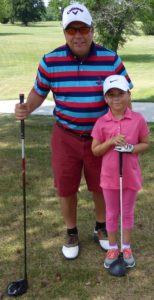 Jeff and Lisa Copeland prepare to tee off in the annual Applebee’s Parent-Child event on Father’s Day prior to the start of Little People’s.